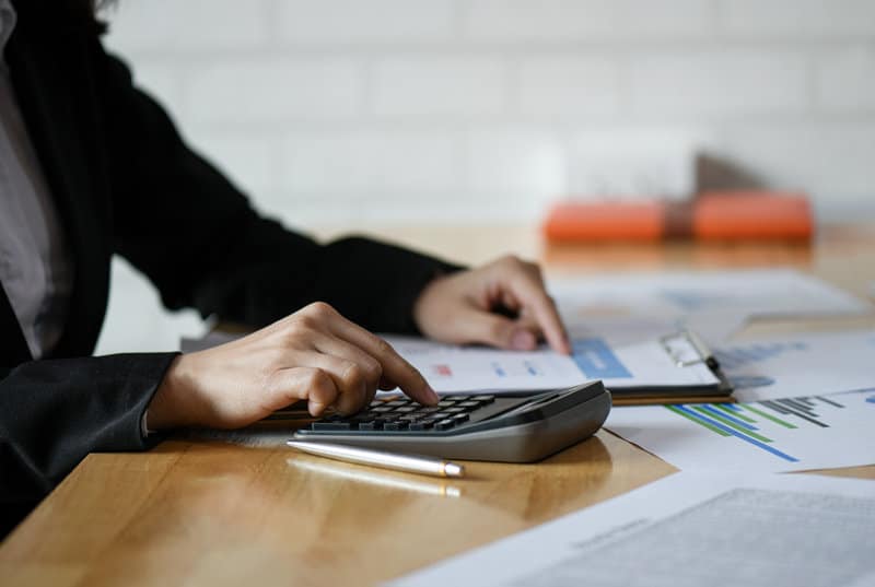 An insurance agent calculating the risk of a client.