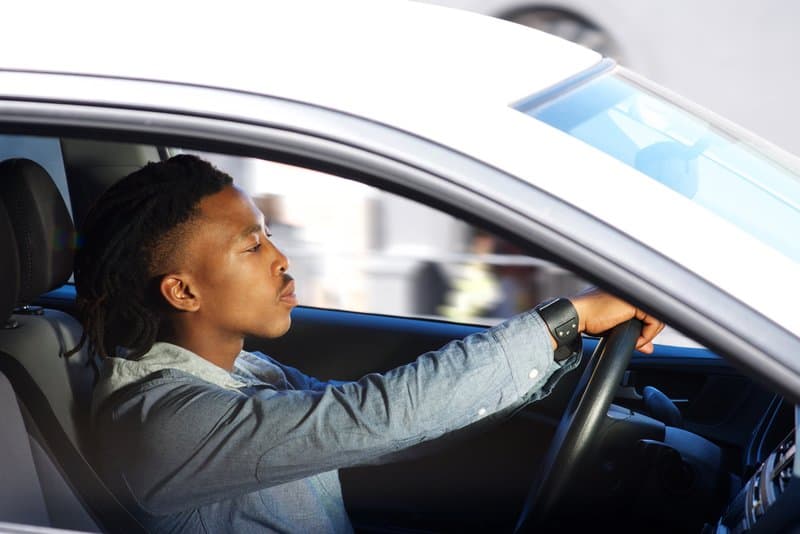 A new young driver in his car.